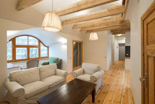 Wooden design. Apartment with wooden floors, ceilings and furnit