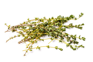 Fresh thyme sprigs lie on a white background, not isolated.