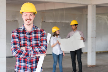 Westerner Construction engineer smile wear yellow safety helmet