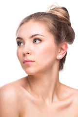 Beautiful Young Woman isolated on a White Background. Touching Her Face. Fresh Clean Skin.