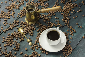 Coffee cup, spoon, and pot with grains