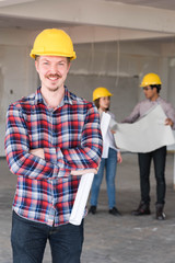 Construction engineer smile wear yellow safety helmet with blue