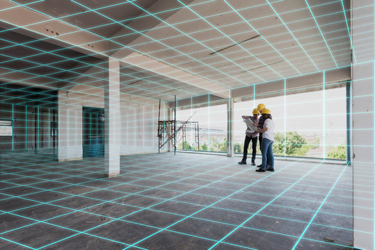 Three construction engineer discuss inside building, plan for re