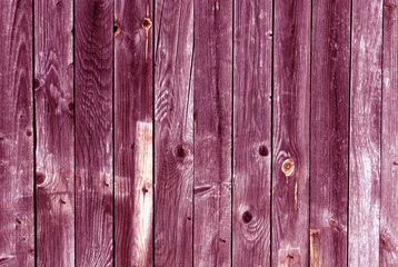 Weathered pink wood wall texture.