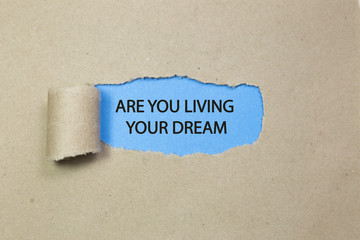are you living your dream written under torn paper