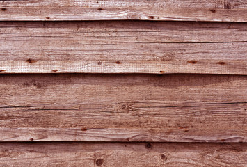 Obraz premium Red toned wooden wall surface.