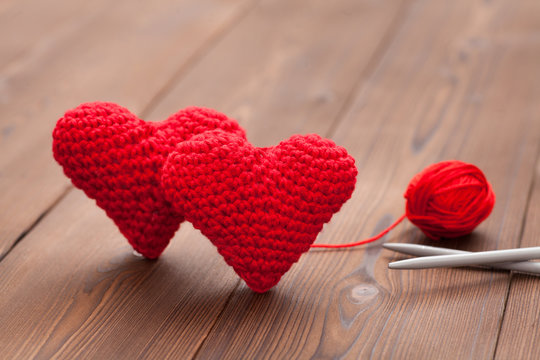 Two Knitted Hearts With Wool And Knitting Needle As Symbol For Love To Knitting