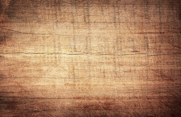 Brown scratched wooden cutting board. Wood texture