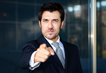 Fototapeta premium Friendly businessman pointing his finger at you