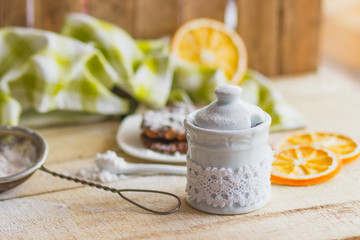 Sugar bowl and cookies on the plate