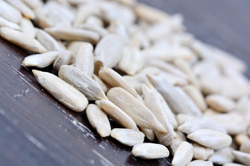 Many sunflower seeds on table
