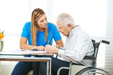 Consultation of senior man in wheelchair