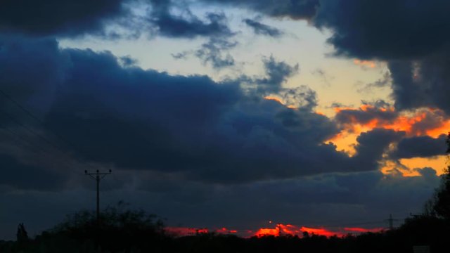 Time lapse video Sunset through clouds