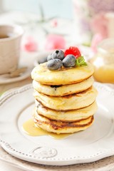 Blueberry pancakes with fresh fruits