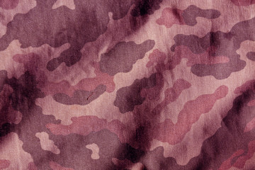 Weathered camouflage cloth texture.