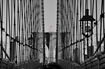 Black and white Brooklyn bridge close up colorful American flag