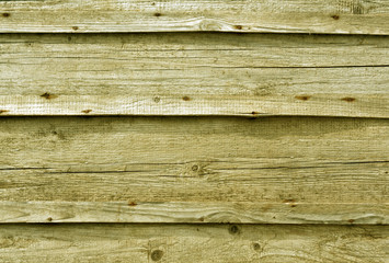 Fototapeta premium Yellow toned wooden wall surface.
