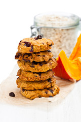 Homemade  pumpkin and orange cookies on white background