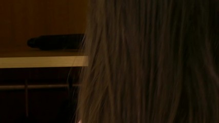 Young girl climbs and finds gun in cupboard, points and shoots, gun safety concept