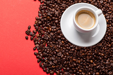 Coffee and beans on red