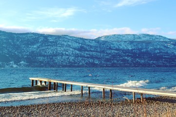 Wooden pier on lake in winter season