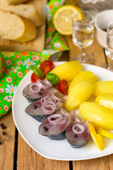 Pickled bismarck herring with onions and potatoes