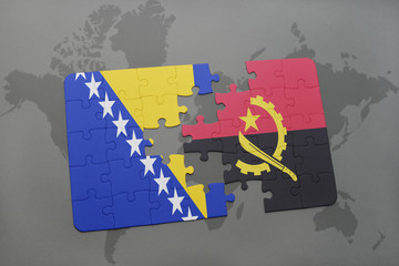 puzzle with the national flag of bosnia and herzegovina and angola on a world map