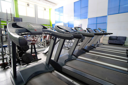 Interior of a fitness hall with treadmills