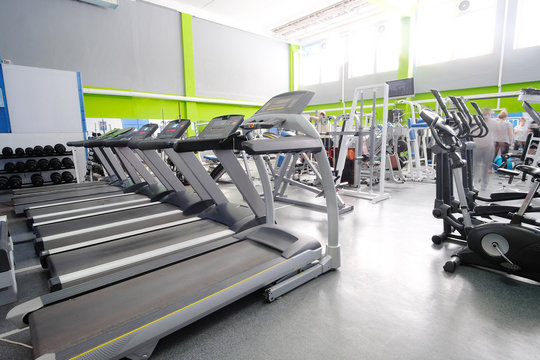 Interior of a fitness hall with treadmills