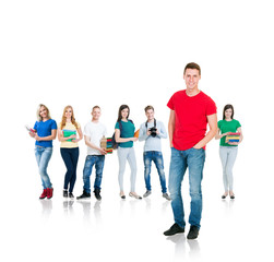 Fototapeta premium Large group of teenage students isolated on white background. Many different people standing together. School, education, college, university concept.