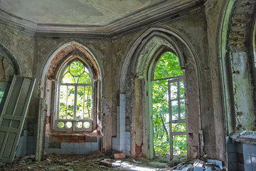 Old rotten doorway of an abandoned mansion of Khvostov  in gothic style 