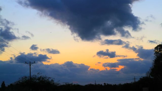 Time lapse video Sunset through clouds