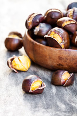 Roasted  sweet chestnuts in wooden bowl