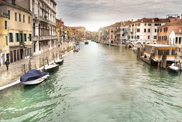 Fototapeta na wymiar Canal with gondolas in Venice, night view, Italy