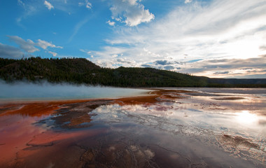 Fototapeta premium Grand Prismatic Spring under sunset clouds in Yellowstone National Park in Wyoming USA
