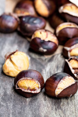 Roasted  chestnuts on wooden background