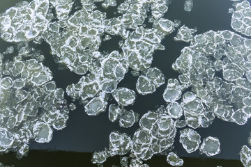 Ice floes floating on the river. Top view. Vistula River in Poland..