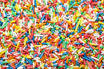 Fototapeta na wymiar Multicoloured sweet sugar balls. Small ball pattern.