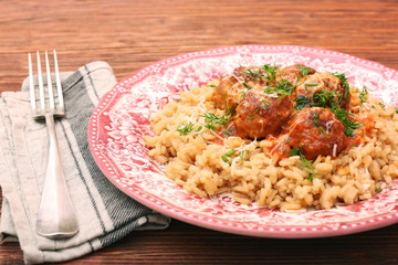 Meatballs in tomato sauce with rice in a bowl