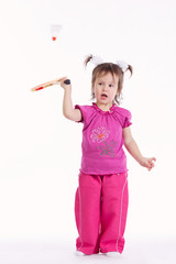photo of little girl playing badminton