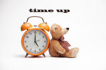 analog clock with teddy bear .time up concept