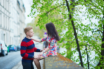Romantic couple in Paris near the Seine