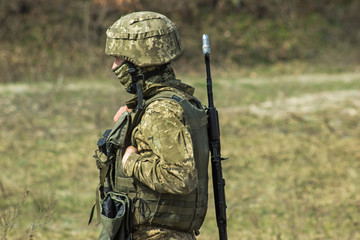 Military at bulletproof vest body armor and helmet