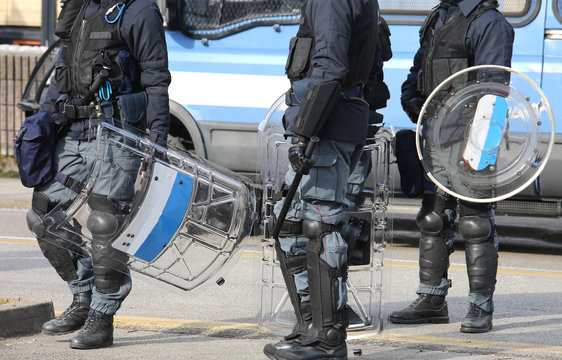 police with shields and helmets during the uprising town