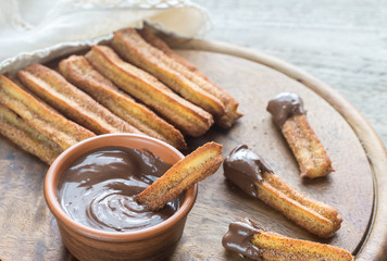 Churros - famous Spanish dessert with chocolate sauce