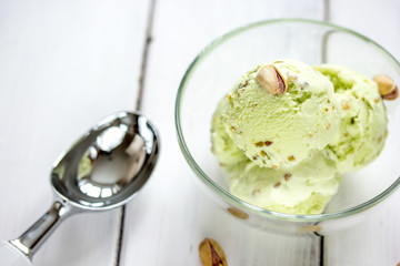 organic homemade ice cream in glass bowl on wooden background
