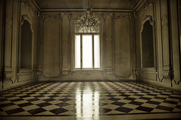 Spooky baroque style room with window, sunbeam and terracotta fl