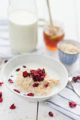Porridge with cranberries and blueberries