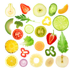 Vegetables and fruits slices on white background