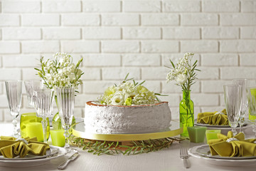 Delicious wedding cake on beautifully served table